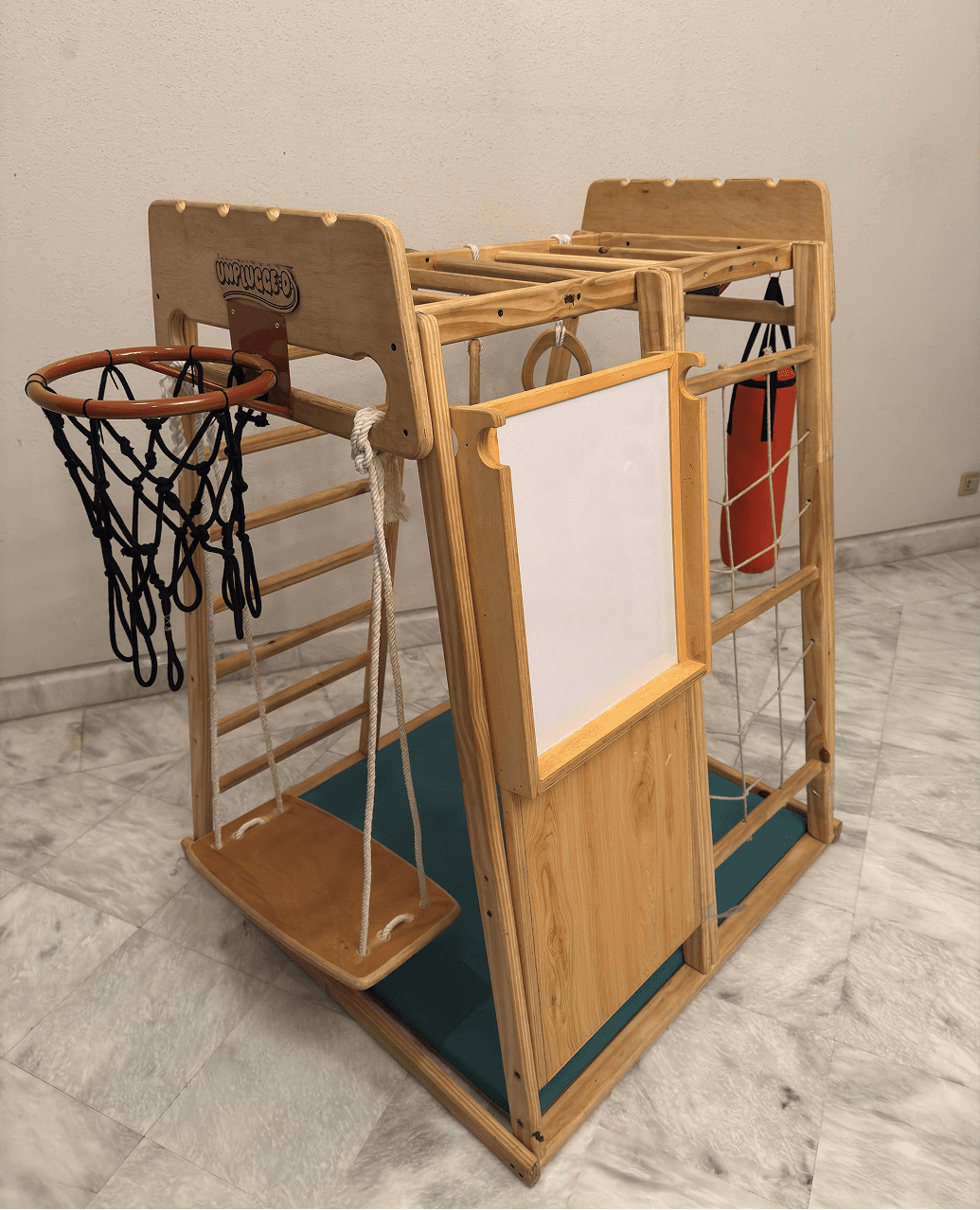 Wooden jungle gym with basketball hoop, swing, ladder, rope ladder and monkey bar